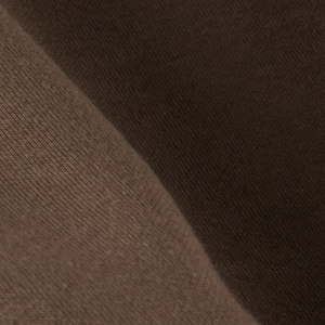 Detailed macro view of dark brown polar fleece fabric showing thick and soft fiber texture