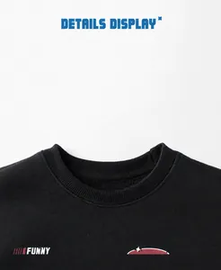 Detail of ribbed crew neck and printed logo on black fleece sweatshirt for kids