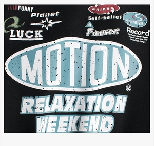 Close-up of artistic graphic prints and slogans on a black fleece-lined warm sweatshirt