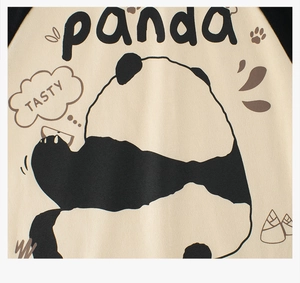 Close-up of kids panda graphic tee featuring bamboo patterns and soft cotton knit texture