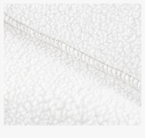 Macro shot of white fleece fabric detailing the neat stitching and plush texture