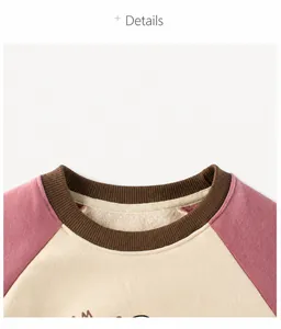 Detail of raglan sleeves sweatshirt with contrast colors and soft fleece lining