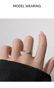 Detail of minimalist moon ring with sparkling crystals on adjustable silver band