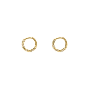 Detail showing twisted golden huggie earrings with pavé set zircon stones on white background