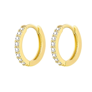 Detail of gold huggie earrings featuring sparkling pave-set round cubic zirconia