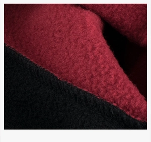 Macro shot of durable double-sided fleece fabric seams on warm children's pullover