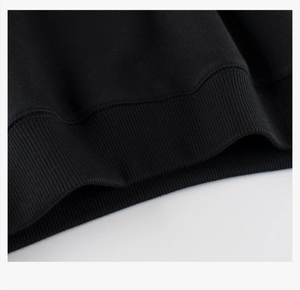 Detailed macro view of black sweatshirt ribbed cuffs and high-quality knit texture