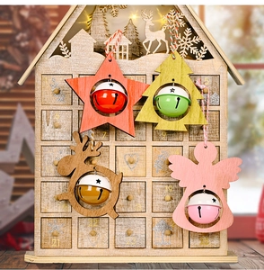 Detail of wooden advent calendar with star bells and festive holiday ornaments