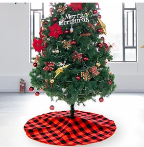 Detail shot of the red and black buffalo plaid Christmas tree skirt with round opening