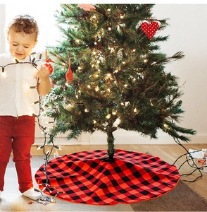Detail view of red and black buffalo plaid Christmas tree skirt around the base