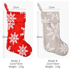 Detail of plush Christmas stockings with white snowflakes, dimensions 50cm by 22cm