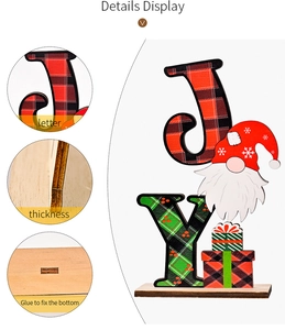 Close-up of wooden Christmas Joy sign with buffalo plaid patterns and durable base plate