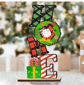 Close-up of wooden HOME sign with Christmas gnome wreath and festive plaid patterns