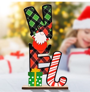 Close-up of wooden NOEL Christmas table ornament with gnome and plaid pattern details