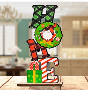 Macro detail of wooden HOME Christmas sign with gnome wreath on a sturdy timber base