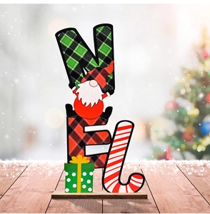 Detailed view of NOEL wooden gnome ornament with plaid patterns on a festive desk