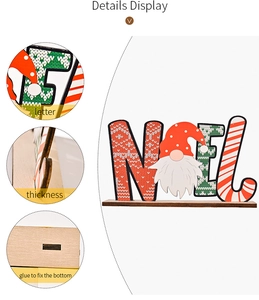 Macro details of NOEL wooden Christmas sign showing letter texture and base slot