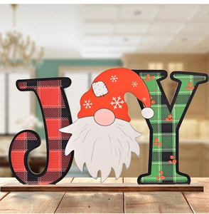 Detailed view of JOY Christmas wooden gnome sign with red and green plaid patterns