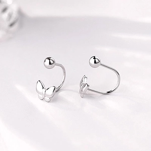 Minimalist silver butterfly screw back stud earrings with a polished finish for women