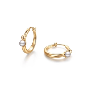 Close-up of gold hoop earrings with white pearl and gold bead details on white background