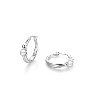 Detail of S925 silver hoop earrings with white pearl and polished bead ornaments