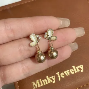 Elegant champagne butterfly earrings with rhinestones and coffee brown pearl drop