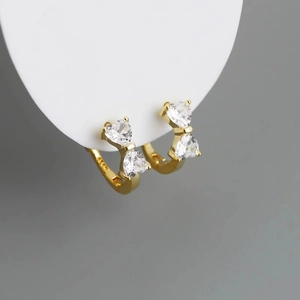 Boucles d'oreilles créoles nœud en argent S925 doré avec zircons en forme de cœur