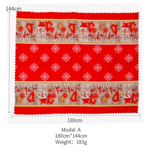 Detail of Christmas tablecloth Model A with festive prints measuring 180cm by 144cm