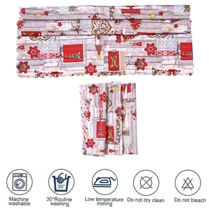 Detailed Christmas table runner featuring festive reindeer prints and scalloped lace edges