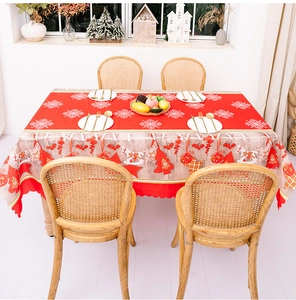 Christmas tablecloth with red snowflake patterns and festive hanging ornament border print