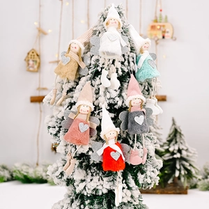 Set of 6 plush Christmas angel ornaments with sequins heart on a snowy white tree