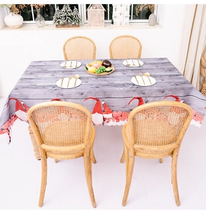 Detail of Christmas table runner with gnome print and festive red heart patterns
