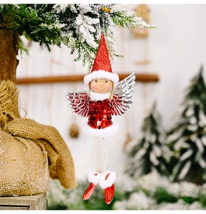 Detail of a Christmas angel pendant with red sequin dress and silver glittery wings