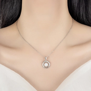 Elegant French style pearl necklace with interlocking diamond circles on a model