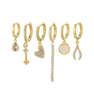 Detailed set of six gold-plated dangle earrings with zircon crystals and drop charms