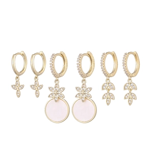 Detailed set of three gold-tone moon and star earrings with crystals and pink shell inlay