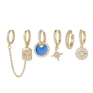 Detailed view of a 6-piece S925 silver star and moon earring set with blue enamel