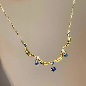 Vintage gold moon necklace with blue drop stones and beaded lace tassel details