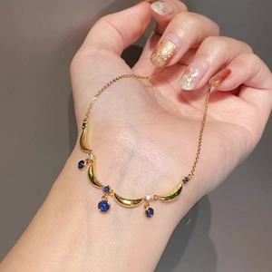 Vintage French crescent moon necklace with blue gemstone pendants and gold chain
