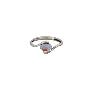 Minimalist adjustable silver ring with light blue gemstone on white background