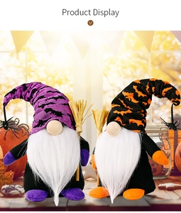 Close-up of Halloween gnome dolls with pointed bat-patterned hats and mini brooms