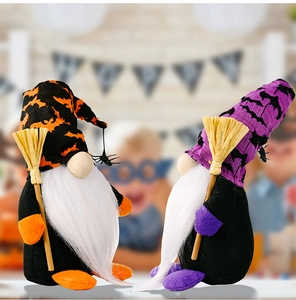 Macro view of Halloween gnome plush dolls with bat hats and mini hay brooms for decor