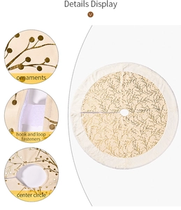 Detail view of cream Christmas tree skirt with gold branch pattern and plush border