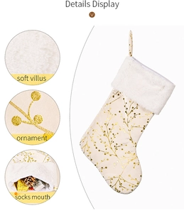 Detail of cream Christmas stocking with golden leaf pattern and soft white plush cuff