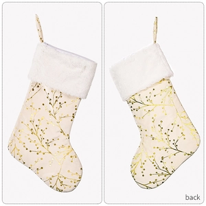Detail of Christmas stocking featuring gold branch pattern and white faux fur trim