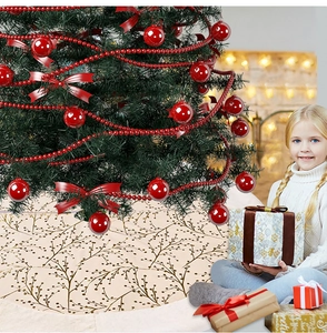 Detail of plush Christmas tree skirt with gold branch pattern and faux fur edge