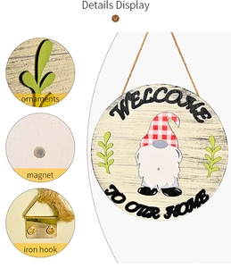 Detail of wooden welcome sign with magnetic gnome and rustic metal hanging hook components