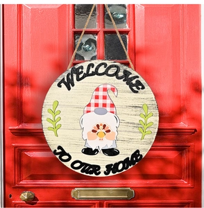 Gnome and turkey round wooden welcome sign hanging on a bright red door decoration