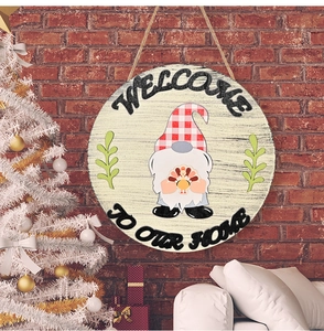 Detail of wooden welcome sign with festive gnome and turkey on a rustic brick wall background