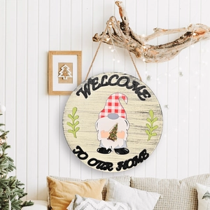 Rustic wooden Welcome To Our Home round door wreath with a Christmas gnome illustration